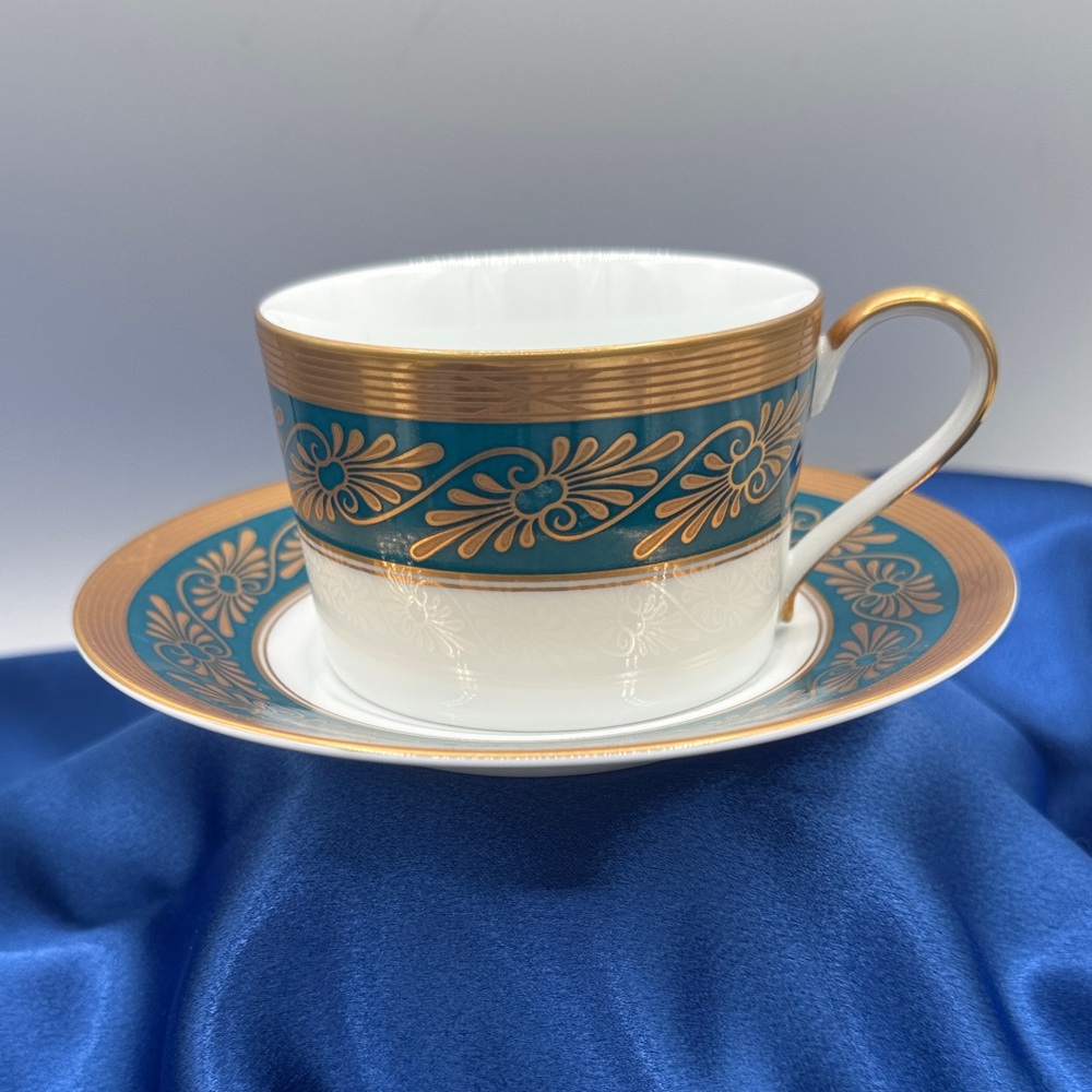 Elegant Teacup and Saucer with Gold and Teal Accents
